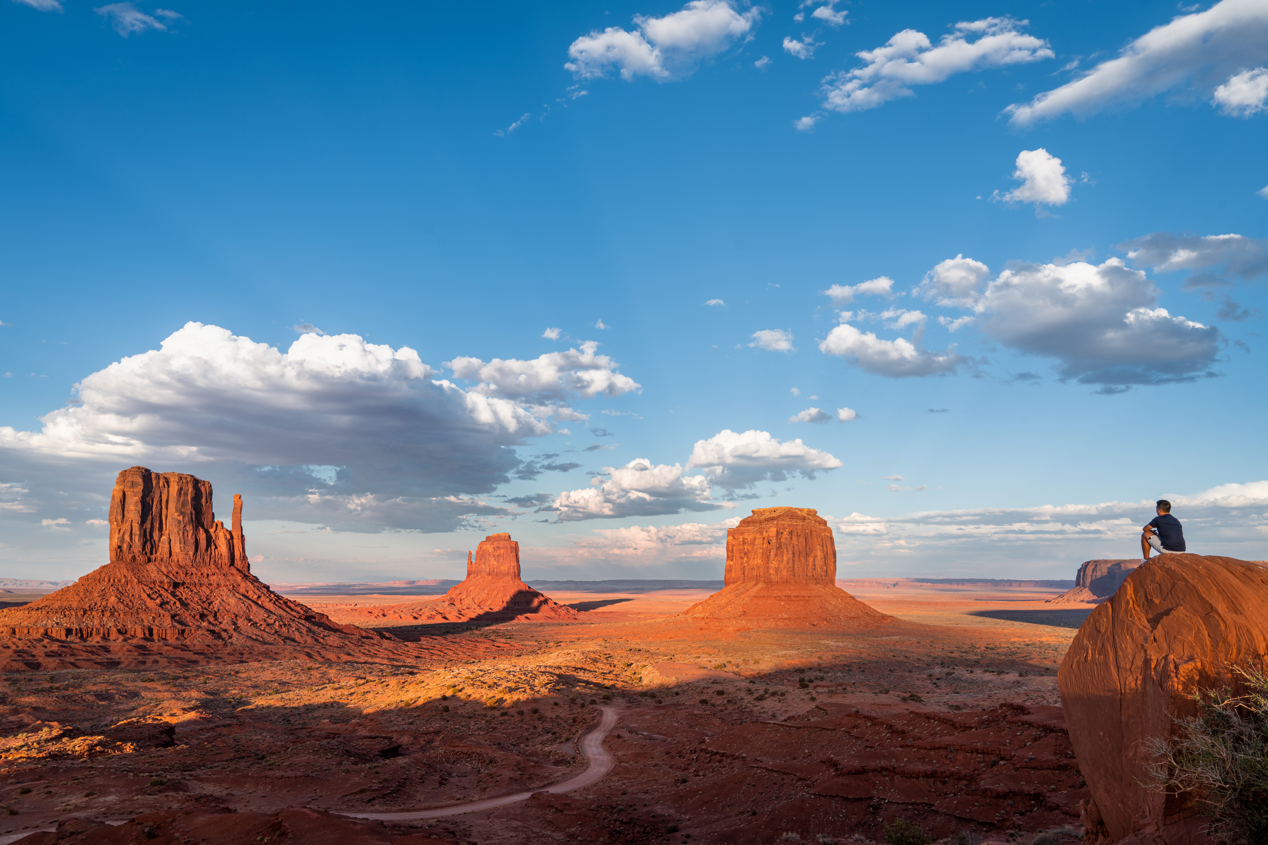 Desert landscape with red rock formations under a blue sky